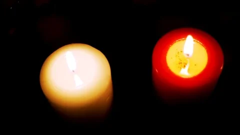 Three candles on table in empty dark room Stock-Footage 74821270
