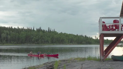 Three canoeist getting to their camp Stock Footage 88301475