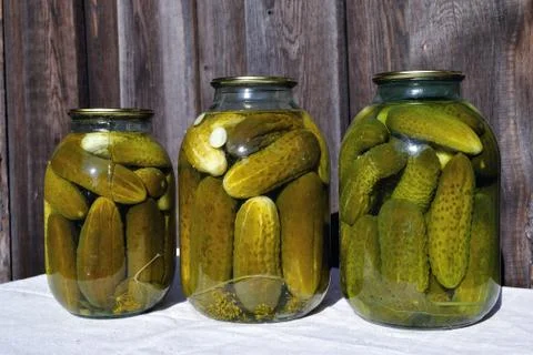 Three cans of pickles Stock Photos