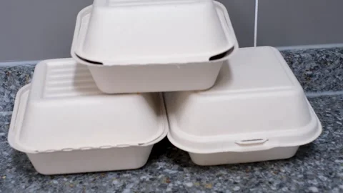 Three cardboard boxes of food in kitchen, food delivery concept. Stock Footage 329728057