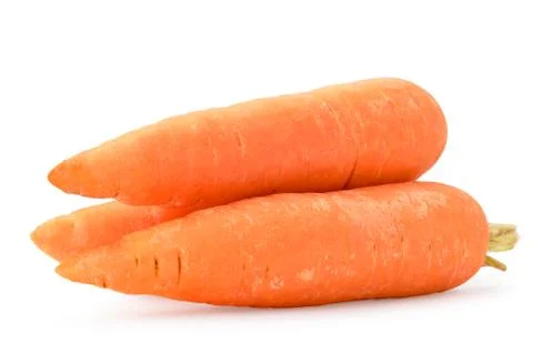 Three carrots close-up on a white. Isolated. Stock Photos