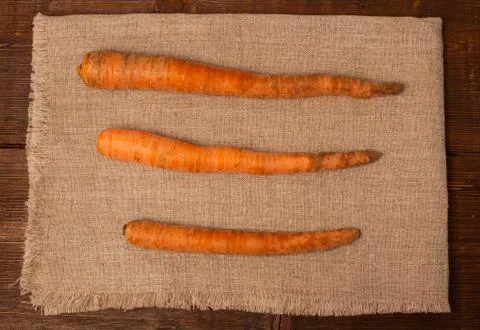 Three carrots on napkin Stock Photos