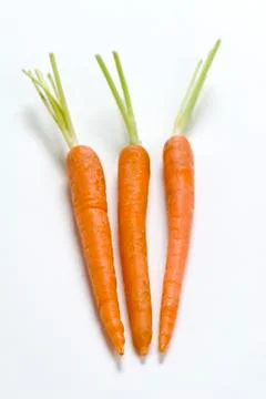 Three carrots Stock Photos
