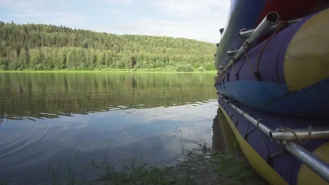 Three catamarans stand on top of each other on the banks of a wild river in the Stock Footage 165238896