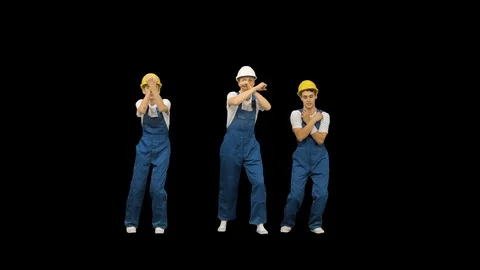 Three caucasian construction workers dancing, Alpha Channel Stock-Footage 125261599