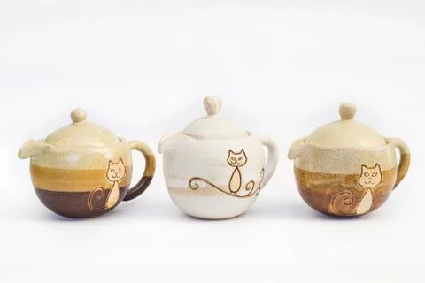 Three ceramic teapots stoneware with white background Stock Photos