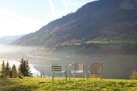 Three chairs at viewpoint in alps Stock Photos
