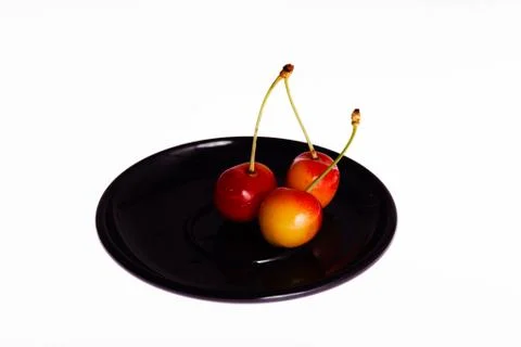 Three cherries Stock Photos
