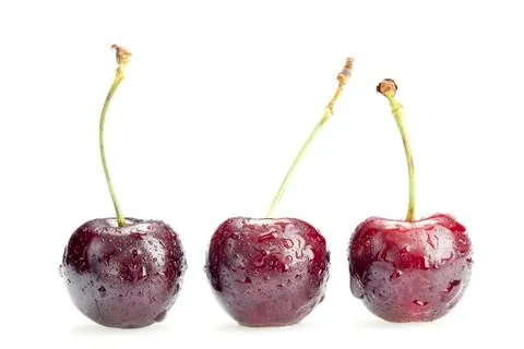 Three cherry berries isolated on white background Stock Photos