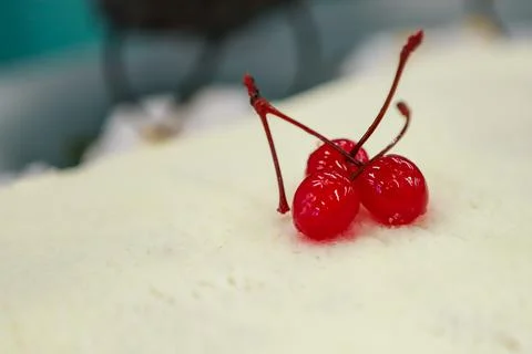 Three cherry berries in syrup Stock Photos