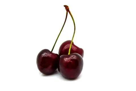 Three cherry berries on a twig Stock Photos