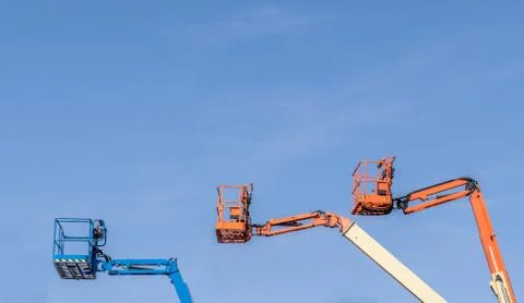 Three Cherry Picker machines Stock Photos