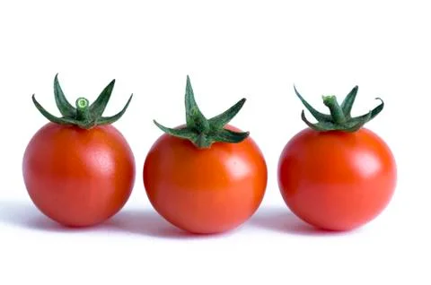 Three cherry tomatoes isolated Stock Photos