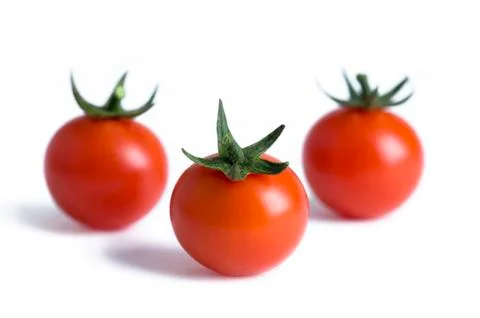 Three cherry tomatoes isolated Stock Photos