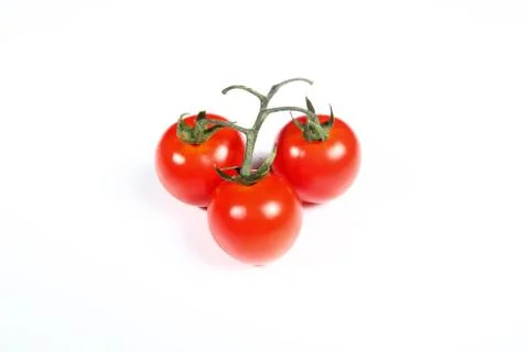 Three cherry tomatoes on white background Stock Photos