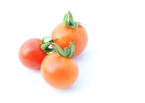 Three cherry tomatos vegetable isolated on white backgrounds Stock Photos