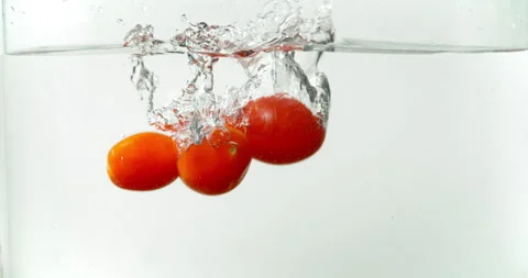 Three Cherry Tomatos in Whater Super Slow Motion 스톡 동영상 247343615