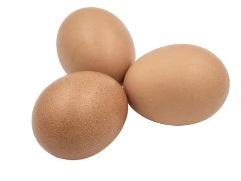 Three chicken eggs on white background Stock Photos