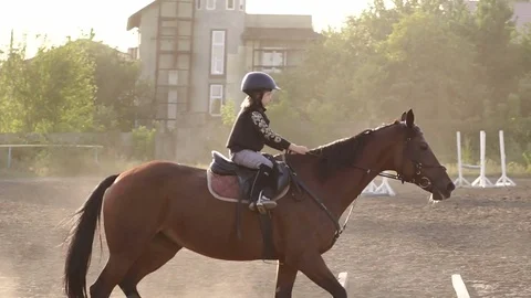 Three children are engaged in horseback riding. Stock Footage 82448516