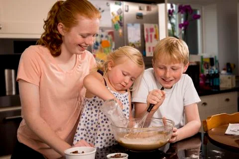 Three children baking Foto stock