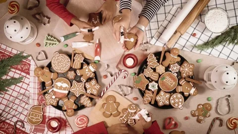 Three children glaze a cookie. Top view of home table. Stock Footage 144335361