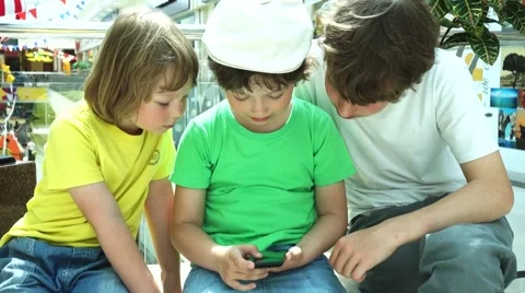 Three children at the mall playing with tablet computer Video stock 66439661