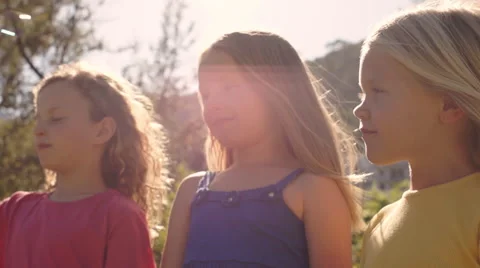 Three children playing with bubbles in park. Stock Footage 43673318