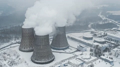 Three chimneys of thermal power plant emit steam into air during heating season Stock Footage 220845057