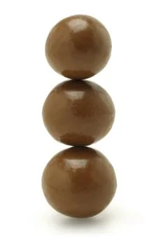 Three chocolate balls Stock Photos