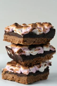 Three chocolate bars with marshmallows on top of each other Stock Photos