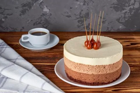 Three chocolate mousse cake and cup of black coffee Stock Photos
