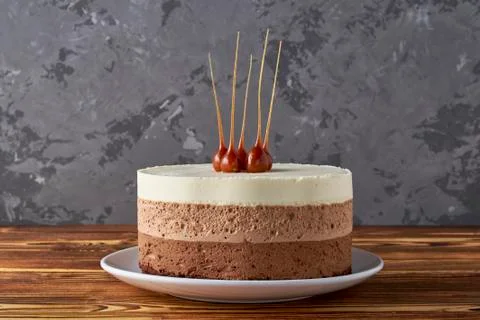 Three chocolate mousse cake. Festive dessert, chocolate pie Stock Photos