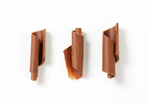 Three chocolate pieces on plain background Stock Photos