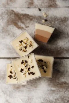 Three chocolates cake. mousse cake on a dark background. Food recipe backgrou Stock Photos