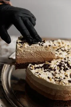 Three chocolates cake. mousse cake on a dark background. Food recipe backgrou Stock Photos