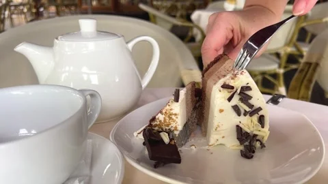 Three Chocolates Cake with sweet souffle cream and sprinkled with chocolate Stock Footage 274455655