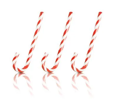 Three Christmas candy canes isolated Stock Photos