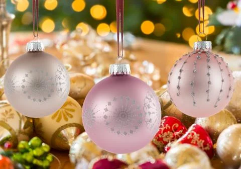 Three Christmas decorations on strings Foto stock