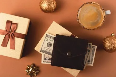 Three Christmas gift boxes on a neutral background among decorations Stock Photos