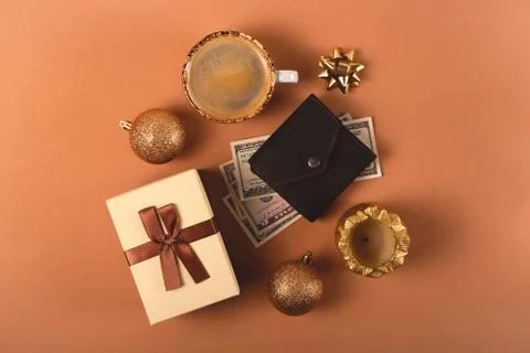 Three Christmas gift boxes on a neutral background among decorations Stock Photos