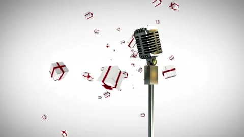 Three christmas gifts, a microphone on a stand, and a background of white are Stock Footage 328936737