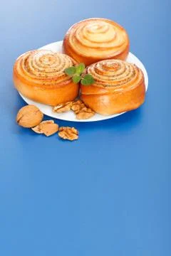 Three cinnamon rolls on plate Stock Photos