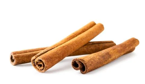 Three cinnamon sticks on a white background, isolated. Stock Photos
