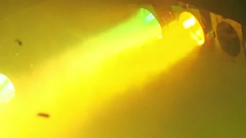 Three classic stage spotlights flash in the fog under the stage ceiling in a 스톡 동영상 155211344