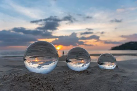 Three clear crystal balls of three sizes are sphere reveals  seascape view wi Stock-Fotos