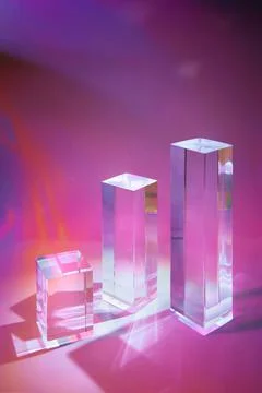 Three clear glass rectangle prism podiums on pastel neon background Stock Photos