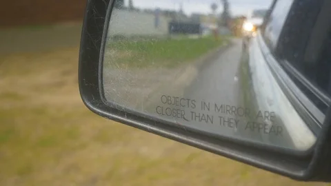Three clips of the view from a car side mirror while driving Stock Footage 93224154