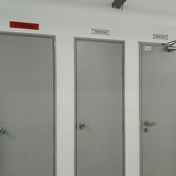 Three closed gray doors Stock Photos