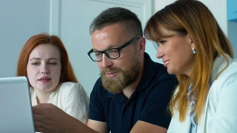 Three co-workers in office 스톡 동영상 93862893