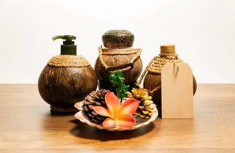 Three coconut spa set with flower and sea shell Stock Photos
